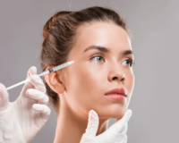 Woman receiving Botox injection from cosmetologist — wrinkle reduction and facial rejuvenation in Georgia