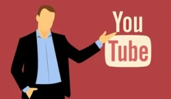 A man points his hand at the YouTube logo, symbolizing a video about your services.