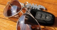 Automotive accessories – car keys and anti-glare driving glasses for safe and comfortable driving