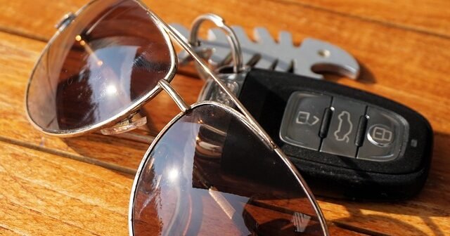 Automotive accessories – car keys and anti-glare driving glasses for safe and comfortable driving